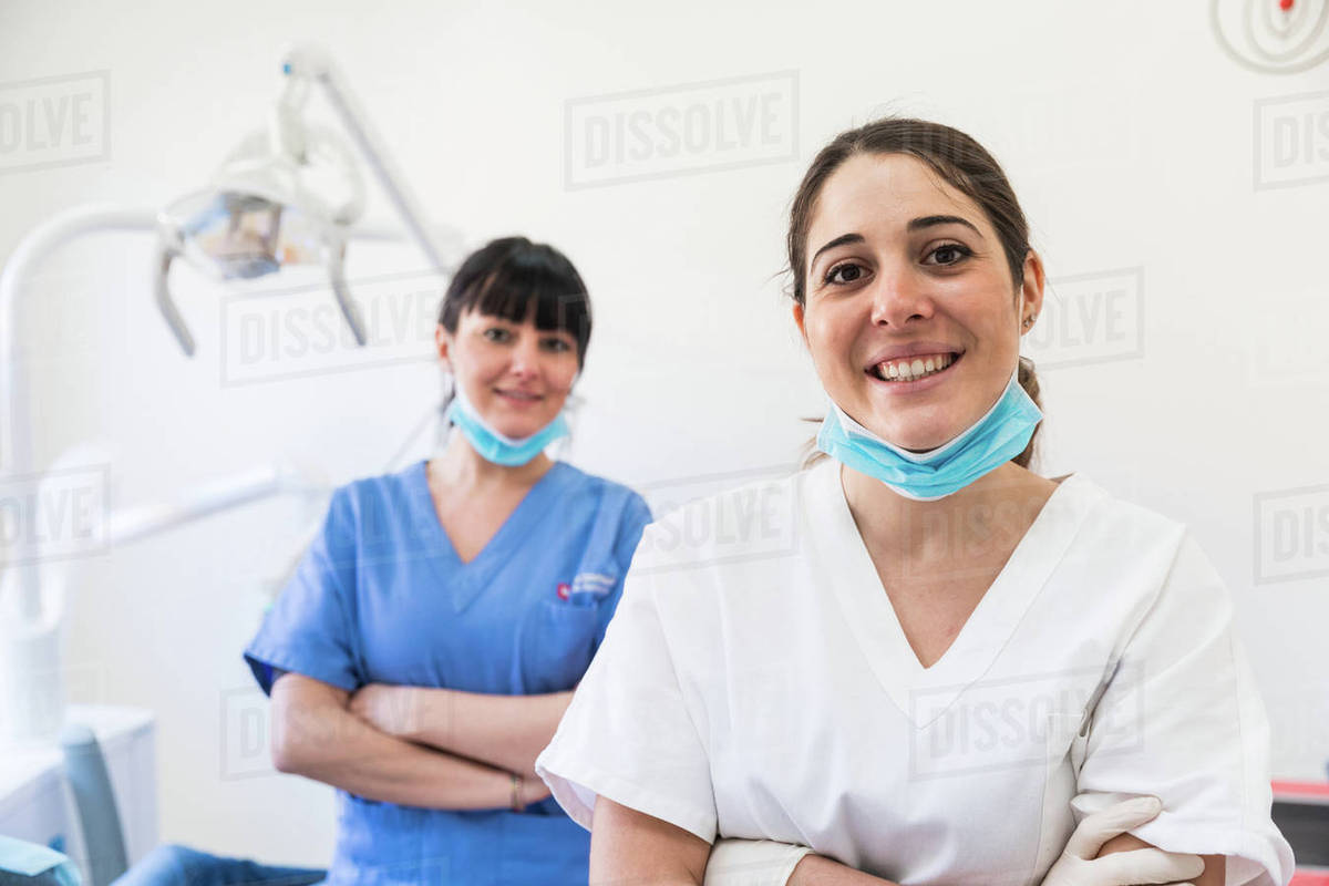 portrait of female dentist and dental nurse stock photo dissolve dentel nurse