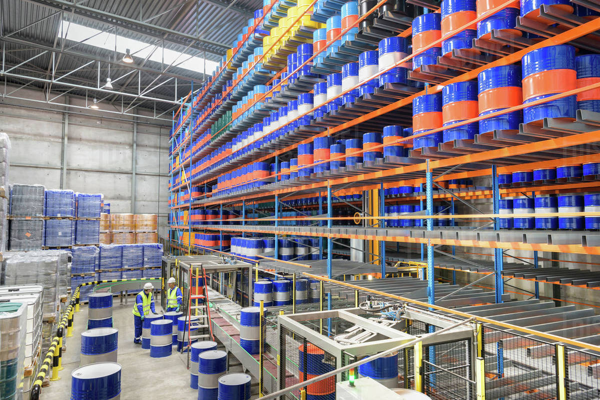 Oil barrels in robotic storage in oil blending factory Stock Photo