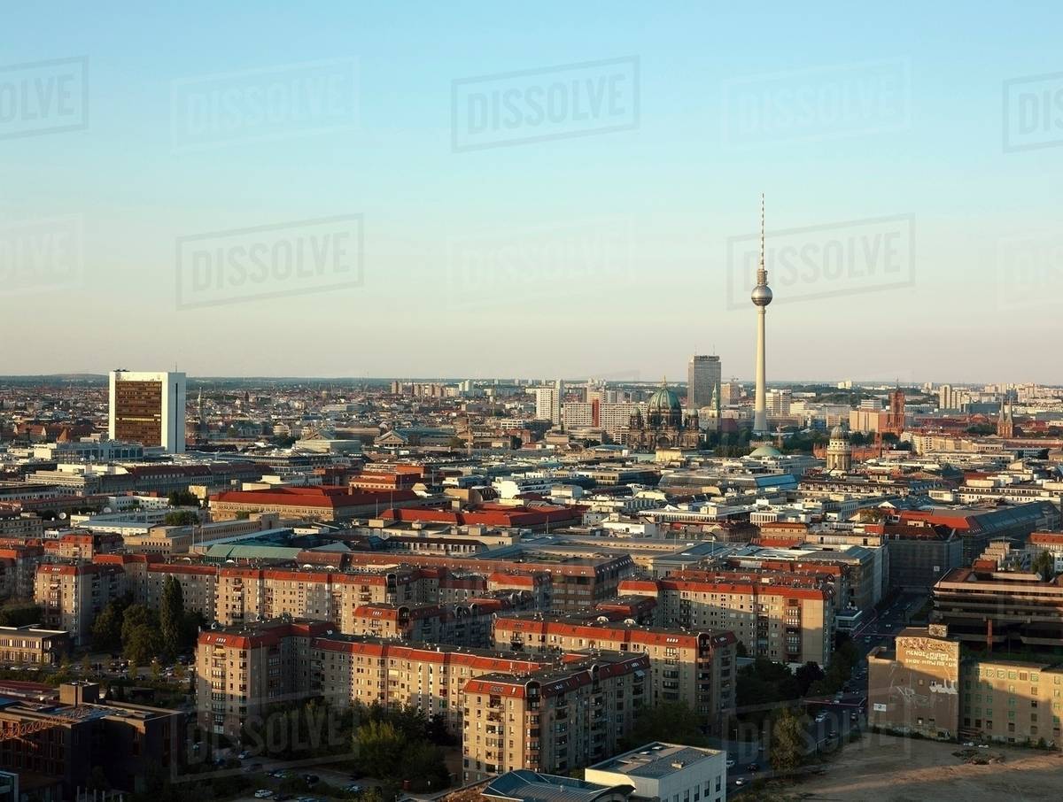 tower reaching over berlin skyline stock photo dissolve