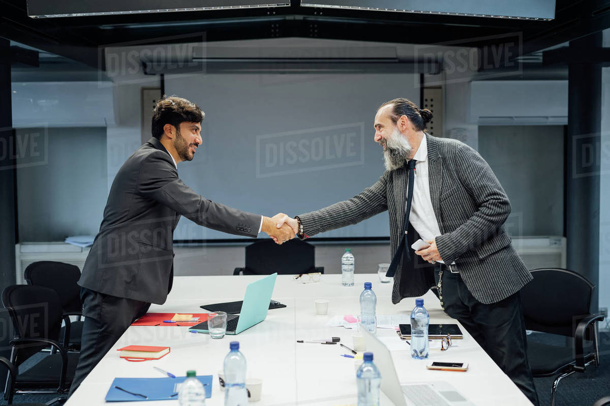 Business partners shaking hands at meeting in office Royalty-free stock photo