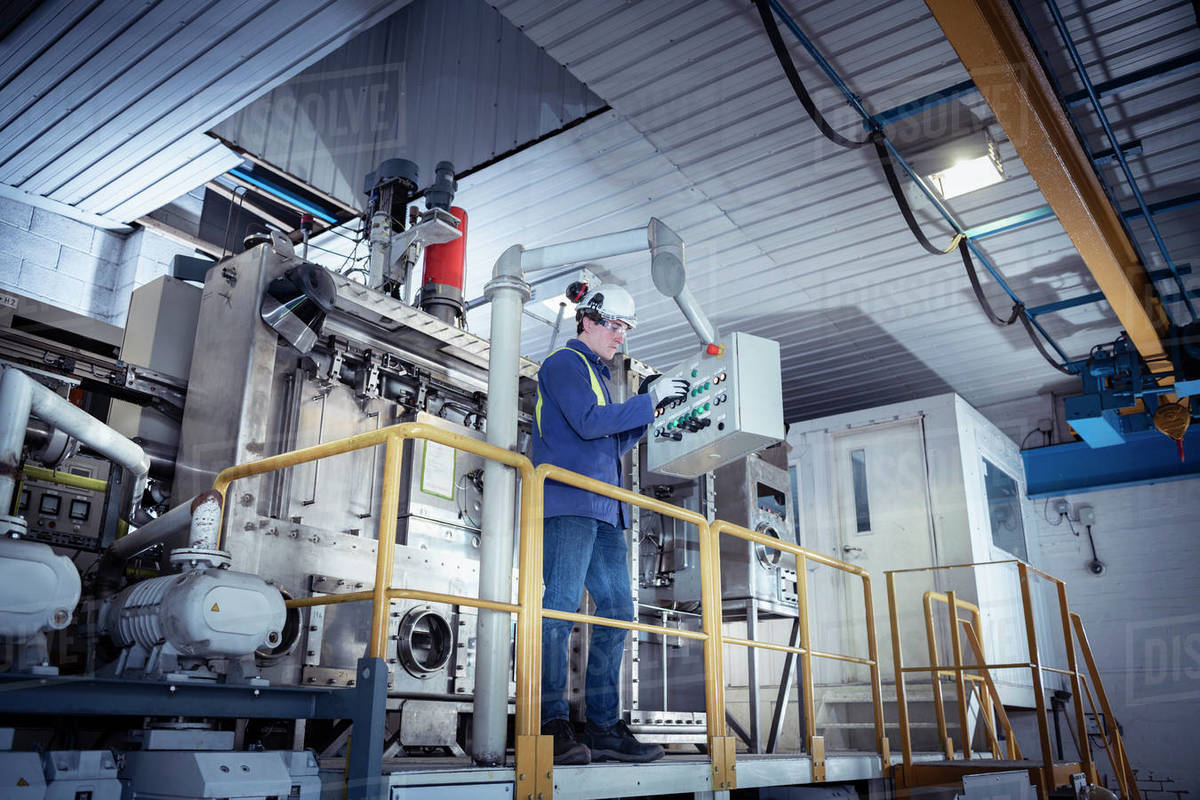 Worker with furnace equipment in titanium recycling plant Royalty-free stock photo