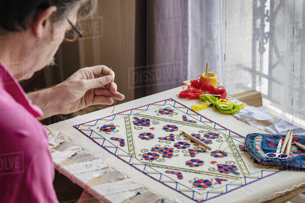 Craftsman busy with needlework indoors, Île-de-France, Paris Royalty-free stock photo