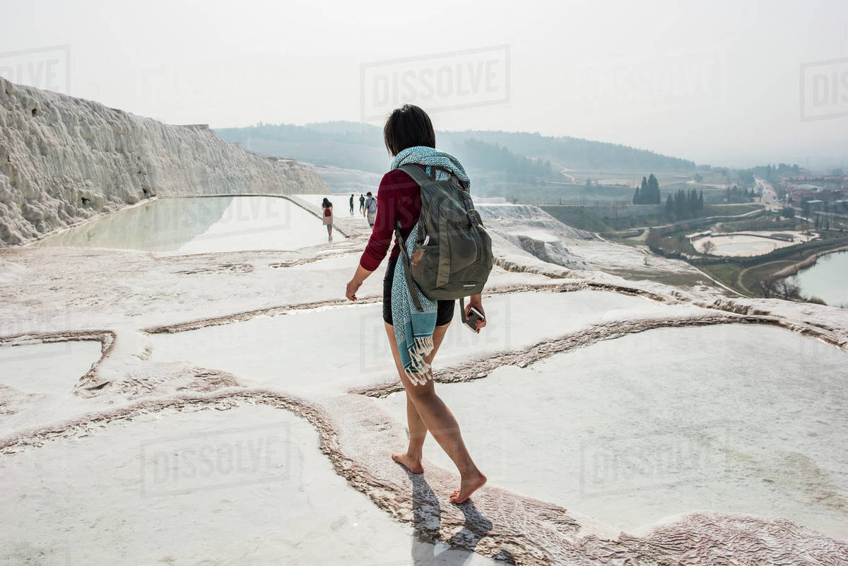 Woman walking across thermal pools, Pamukkale, Denizli, Turkey Royalty-free stock photo
