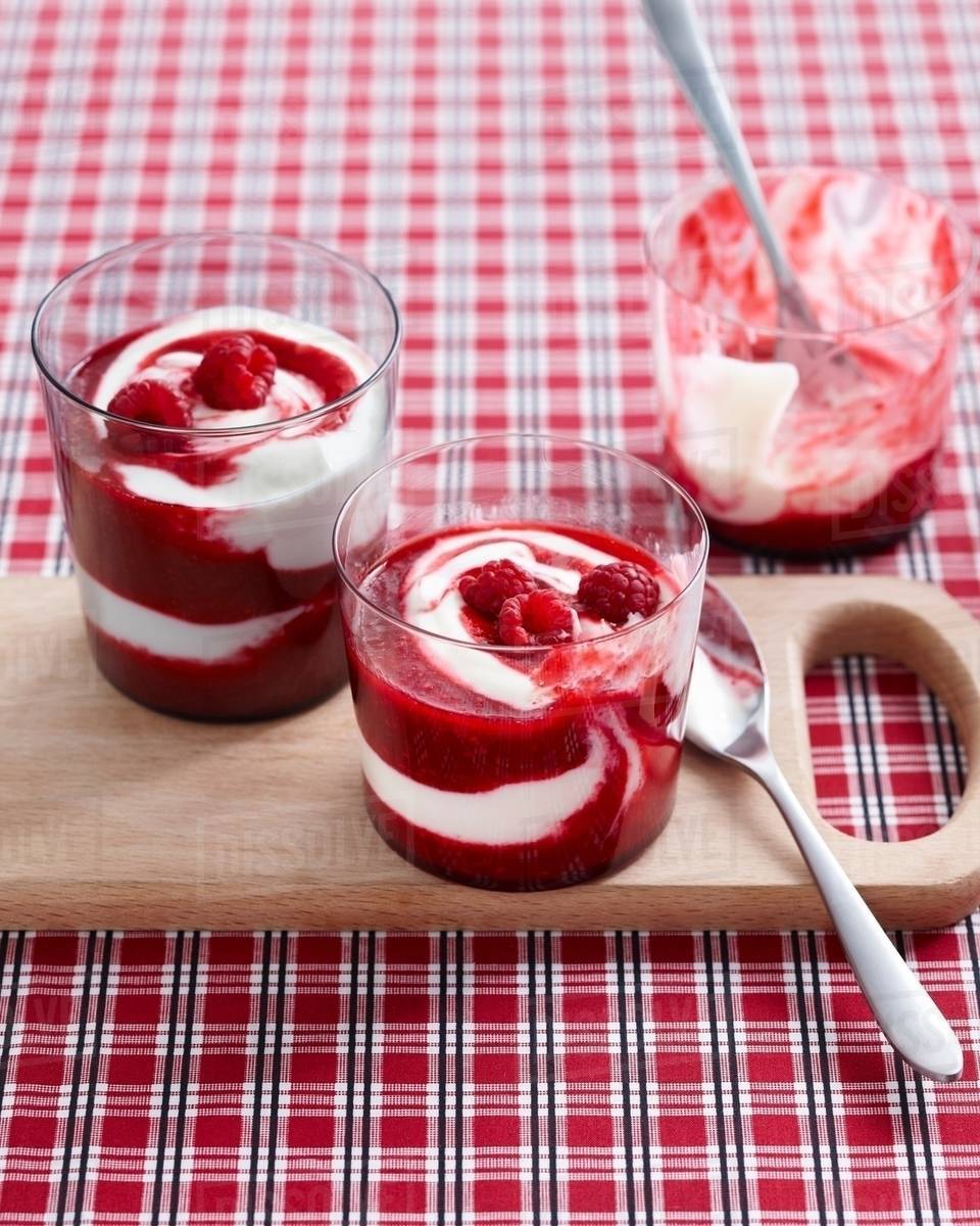 Raspberry swirl desserts garnished with fresh raspberries Stock Photo