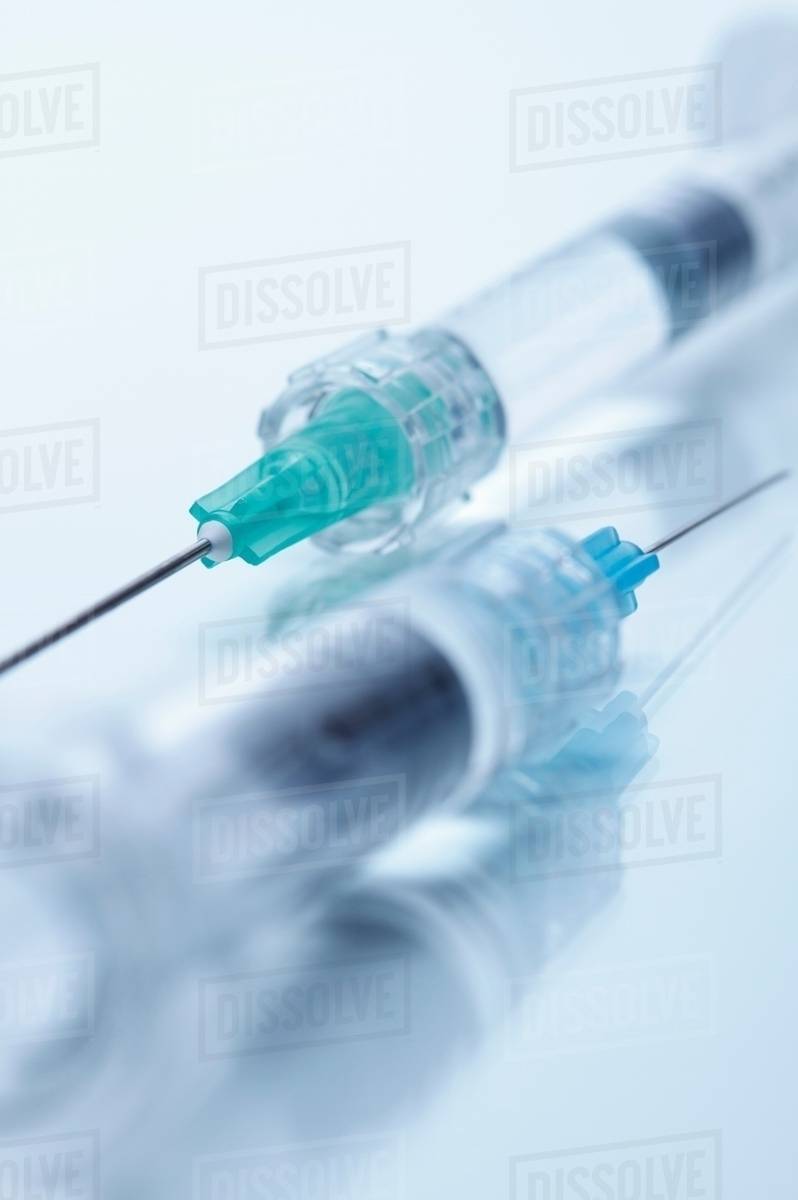 Close up studio shot of two hypodermic needles Stock Photo Dissolve