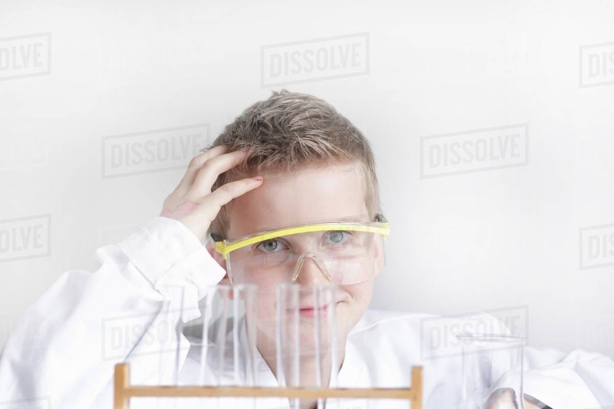 Student wearing safety goggles in lab Stock Photo Dissolve