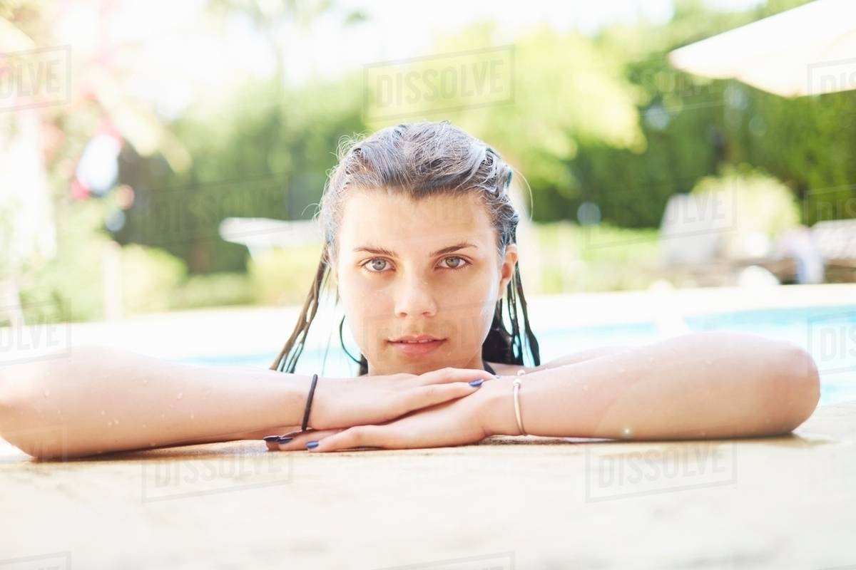 Portrait of teenage girl with wet hair in swimming pool Stock Photo