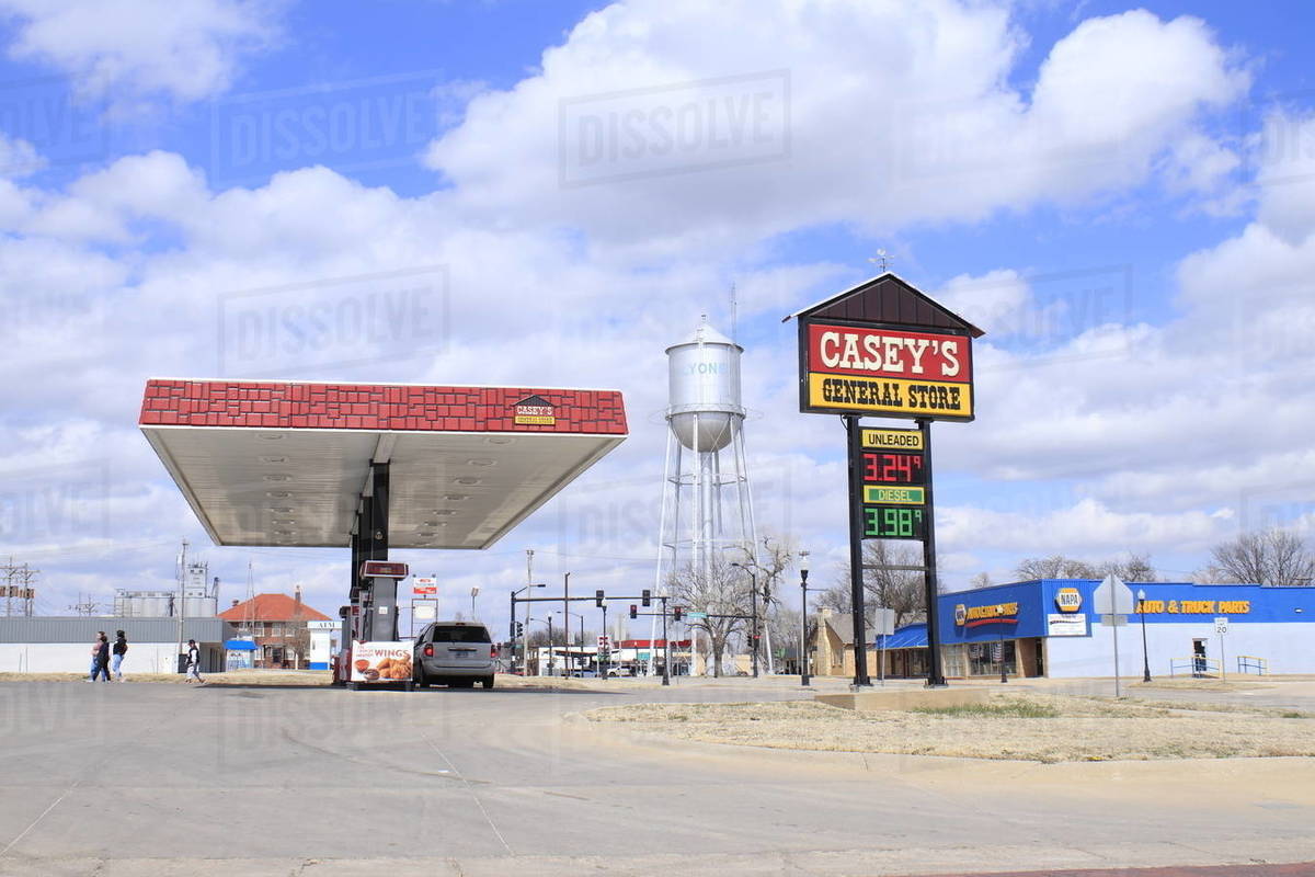 A shot of a Casey's gas station in Lyons Kansas with blue sky and the