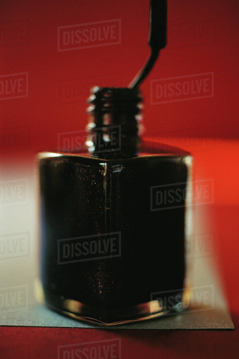 Open nail polish bottle, closeup Stock Photo Dissolve