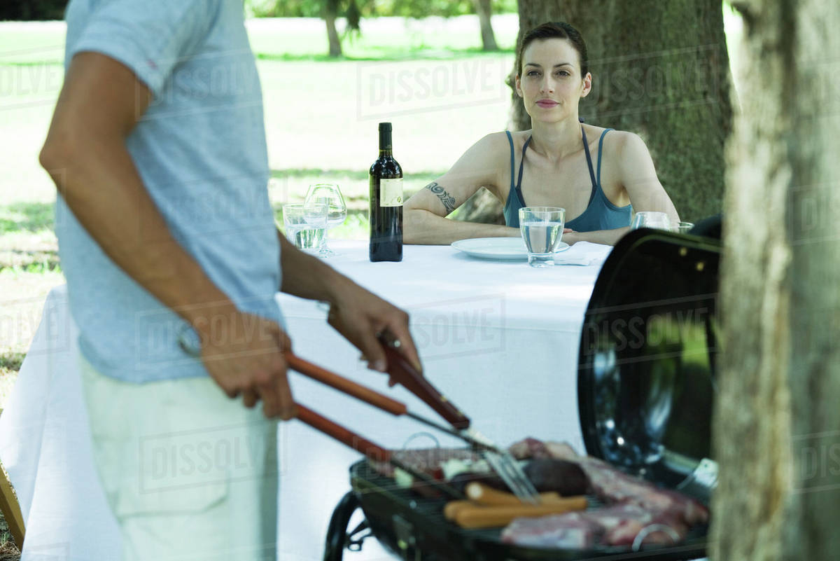 Couple having cookout - Royalty-free Stock Photo | Dissolve