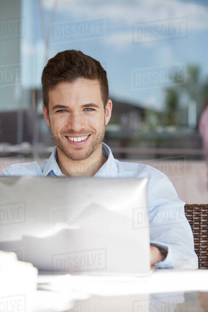 Man using laptop computer - Royalty-free Stock Photo | Dissolve