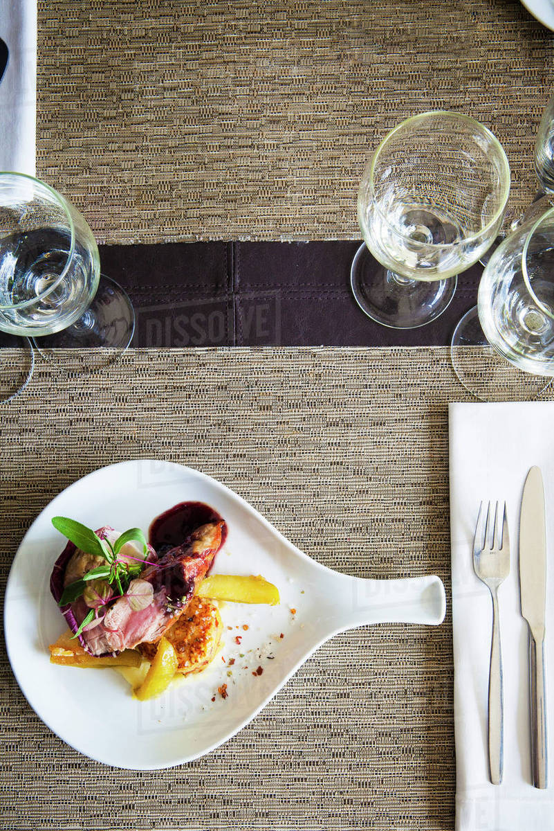 Entree on restaurant table Stock Photo Dissolve