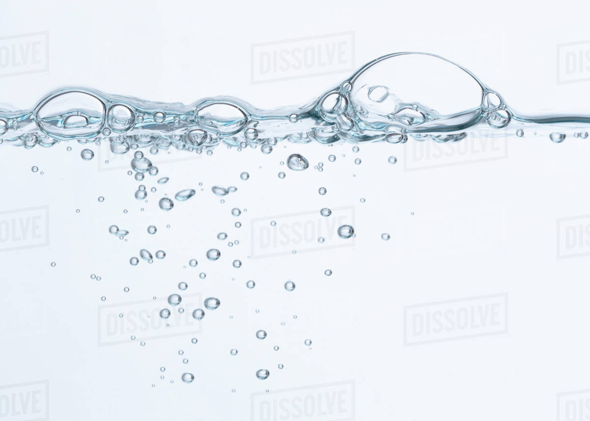 Bubbles on surface of water Stock Photo Dissolve