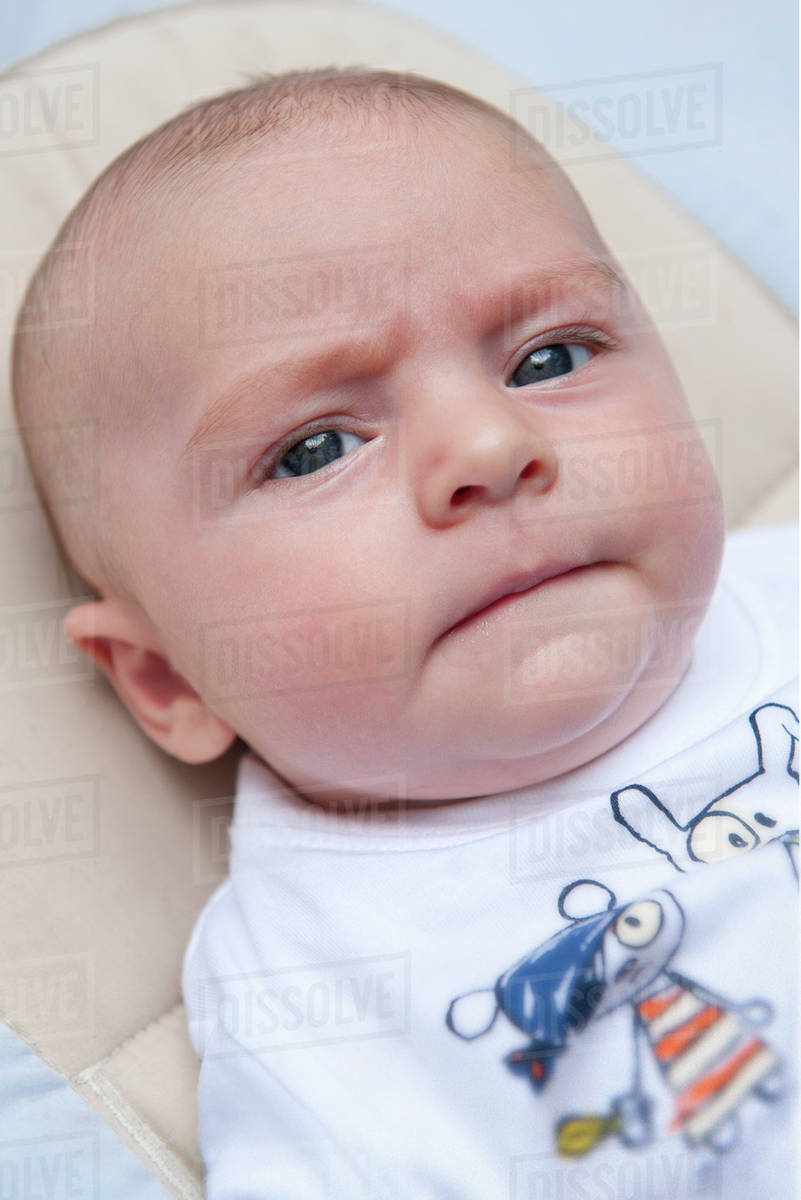 Baby with furrowed brows Stock Photo Dissolve