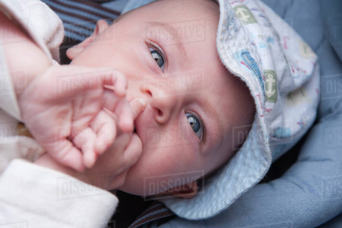 infant hands in mouth