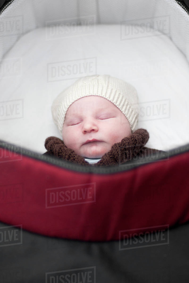 Baby sleeping in pram Stock Photo Dissolve