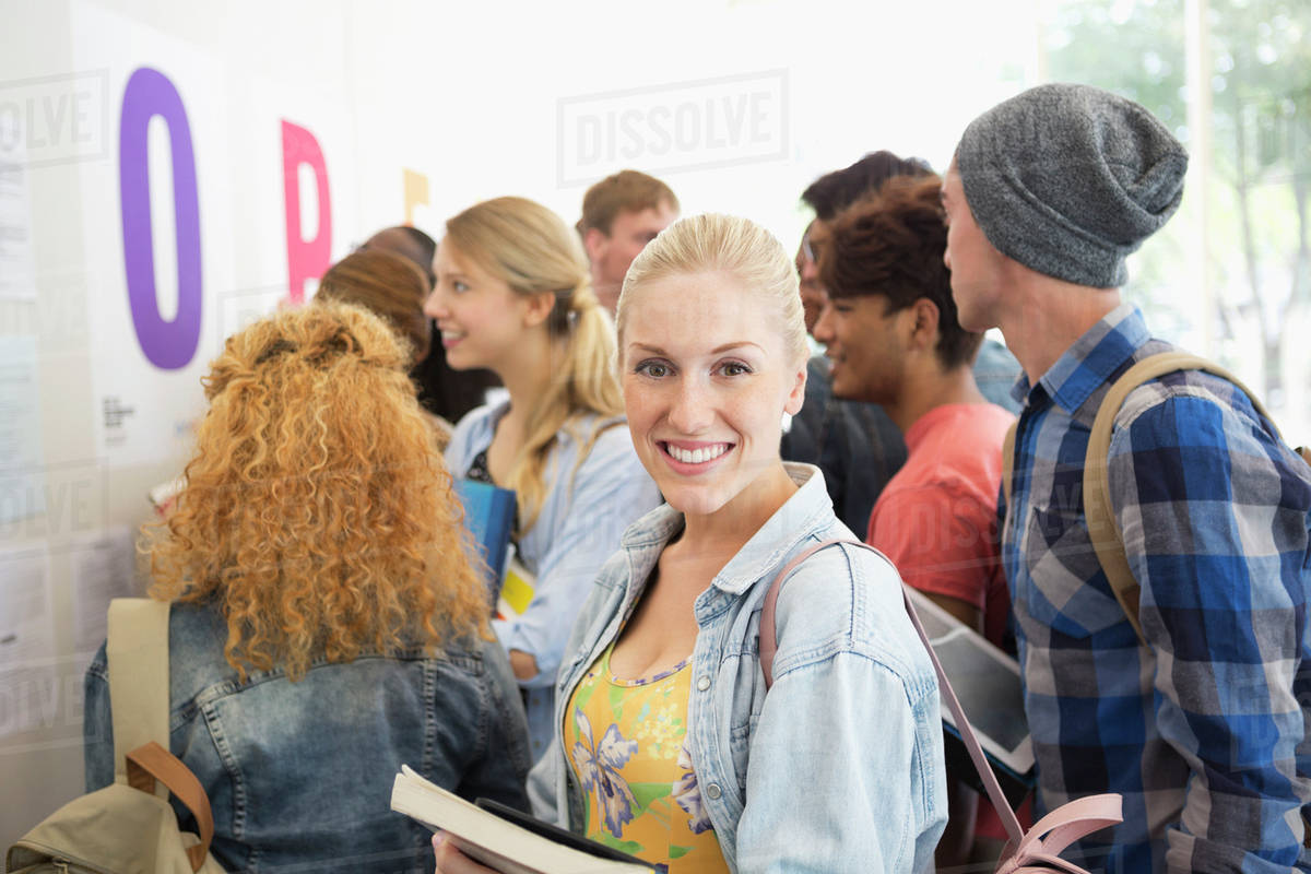 Smiling female student looking at camera - Stock Photo - Dissolve