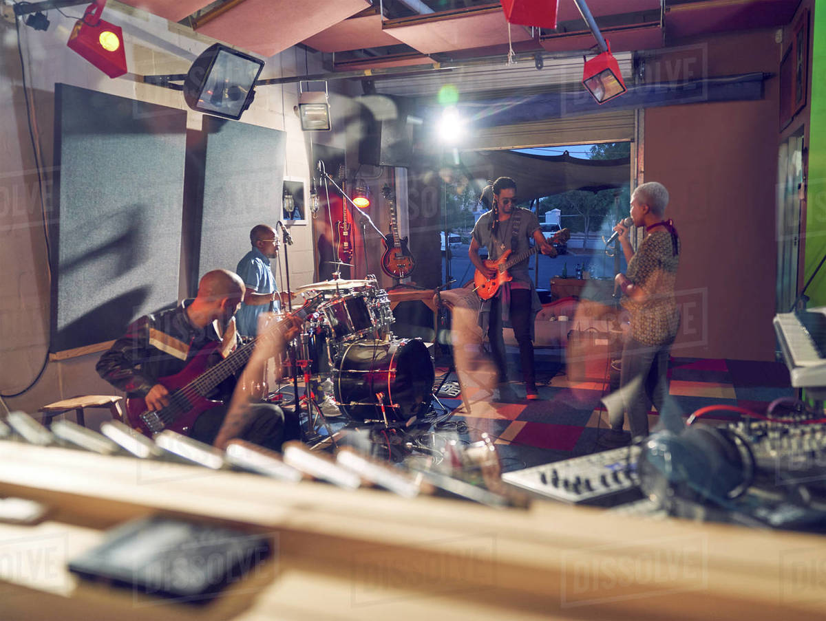 Musicians practicing in recording studio Stock Photo Dissolve