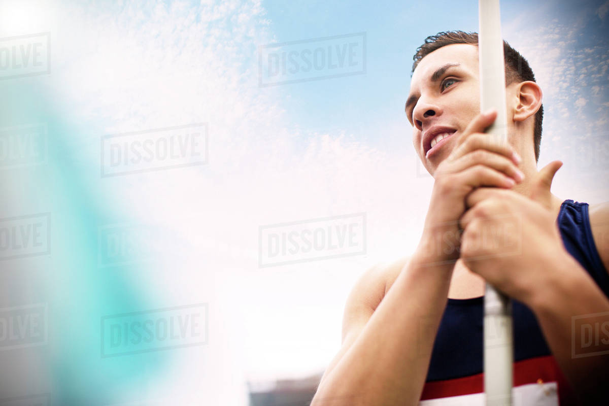 Track and field athlete holding javelin Stock Photo Dissolve