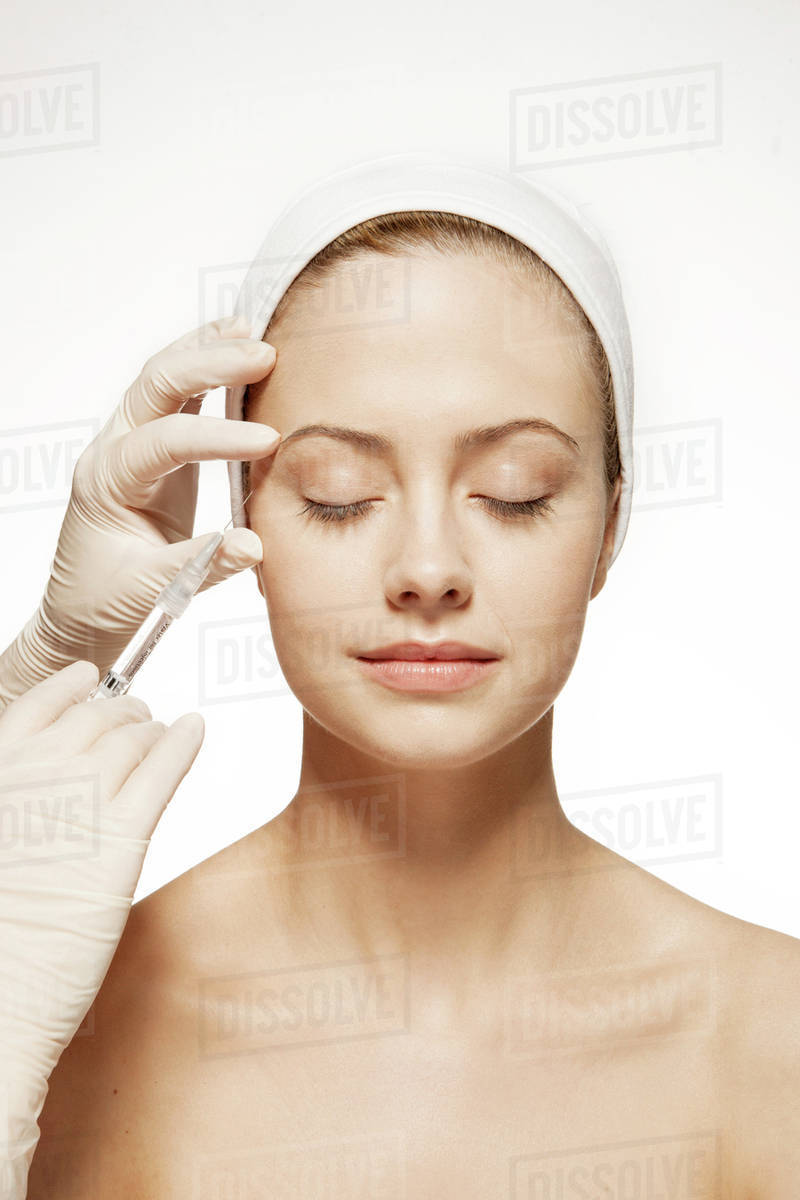 Doctor injecting botox into woman's face - Royalty-free Stock Photo ...