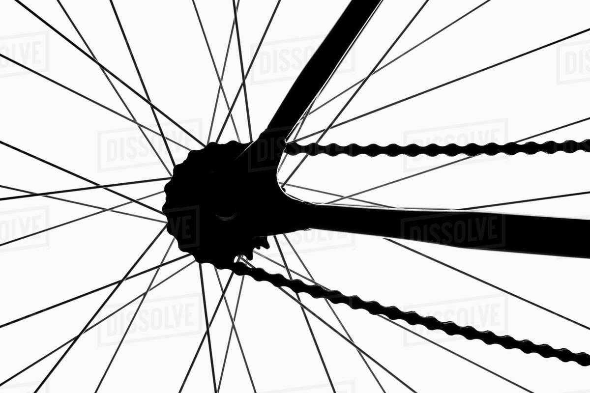 Detail of a bicycle wheel, back lit, studio shot Stock Photo Dissolve