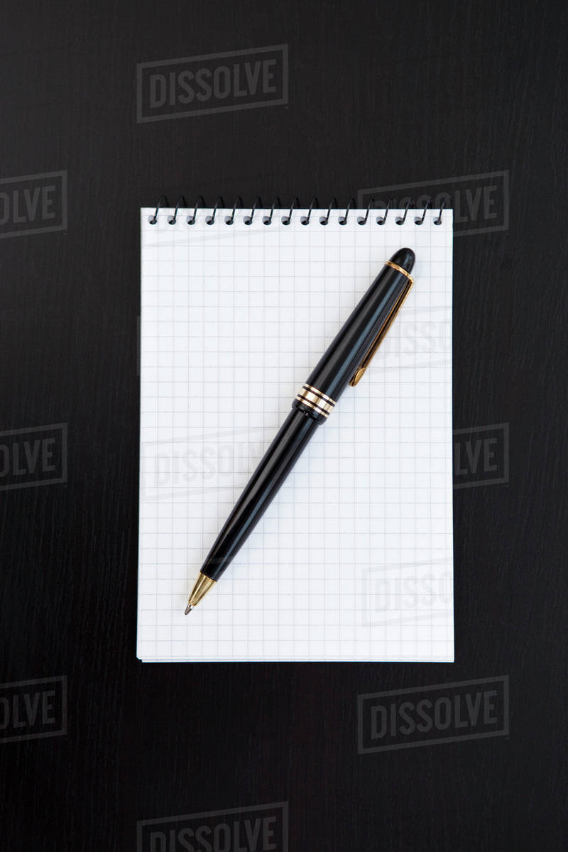 Pen and blank pad Royaltyfree Stock Photo Dissolve