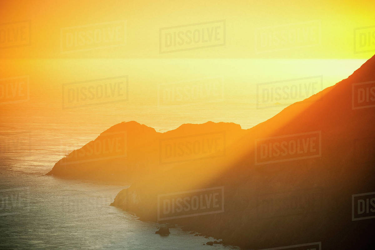 Golden sunset over ocean cliffs, San Francisco, California Royalty-free stock photo