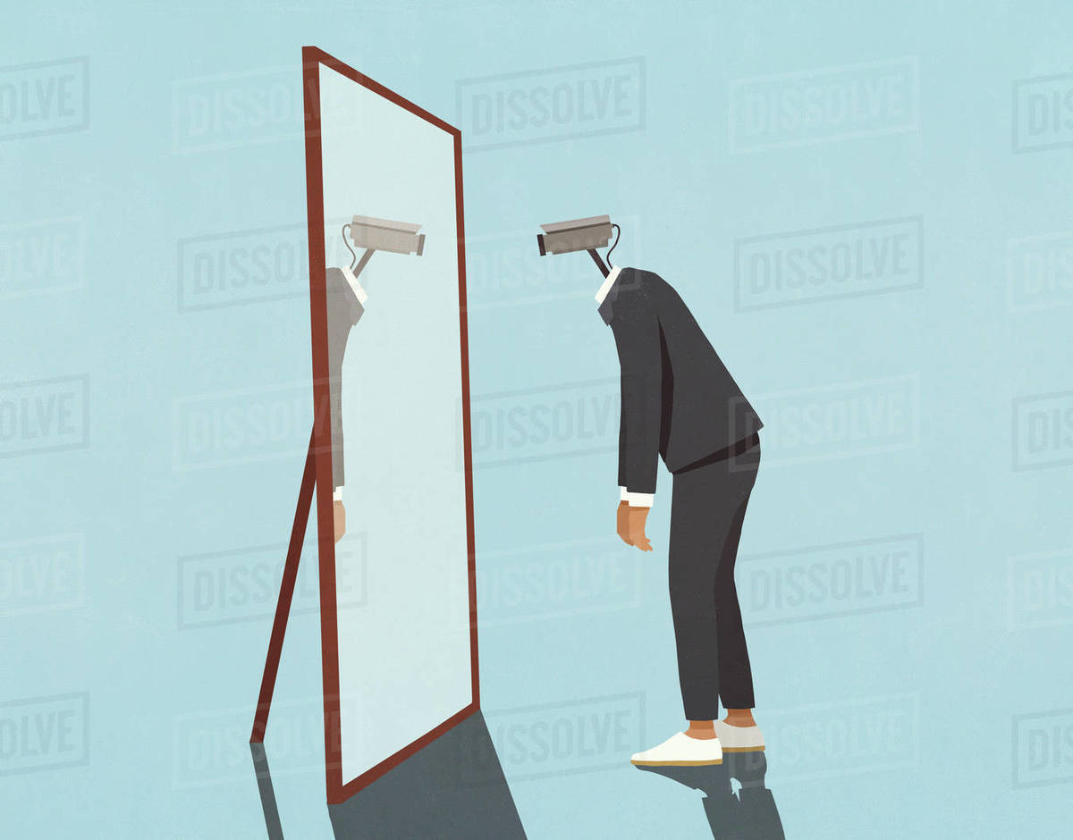 Man with surveillance camera face looking into mirror Stock Photo