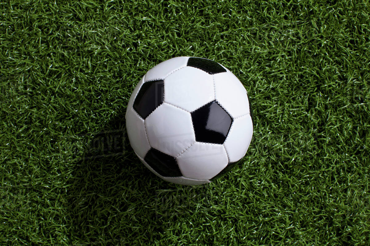 A soccer ball on turf Stock Photo Dissolve